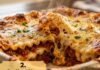 Four Cheese Volcano Lasagna (Ultra Cheesy Lasagna Recipe) Four Cheese Volcano Lasagna with molten cheese center bubbling from golden baked top