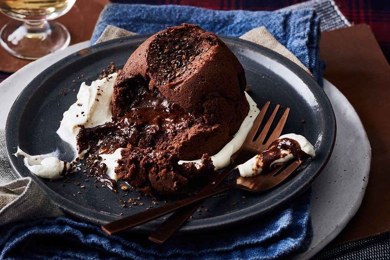 Chocolate lava cake with a warm molten center served on a dark plate