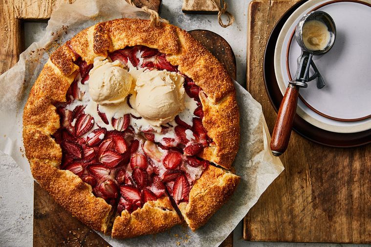 Homemade strawberry and macadamia crostata served with vanilla ice cream